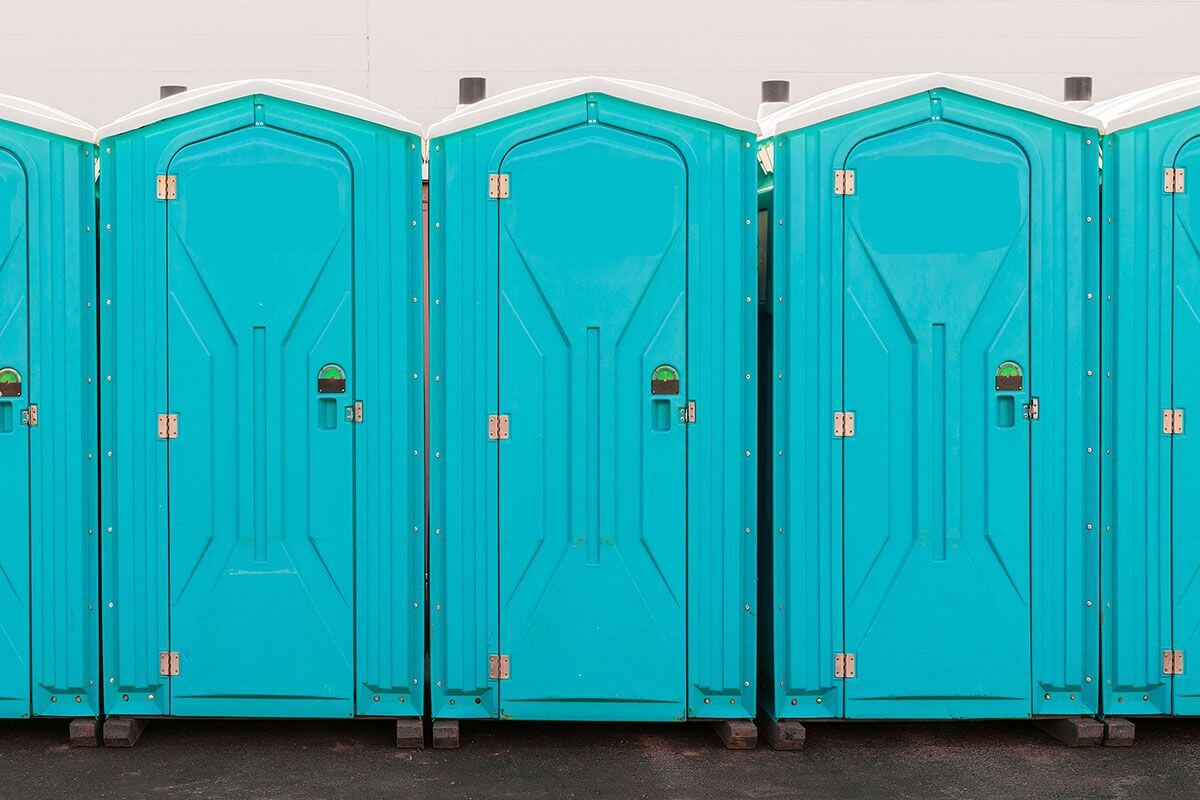 Industrial portable restroom units at a plant in Hackensack, New Jersey
